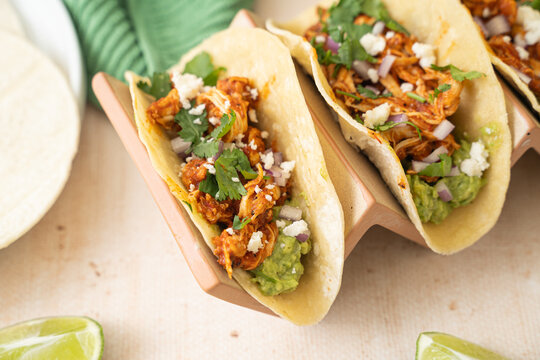 Easy slow cooker chicken tinga tacos. Spicy Mexican food 