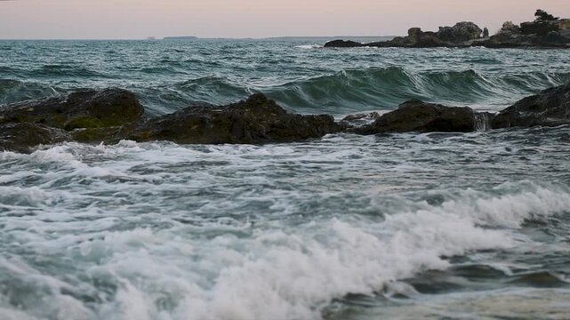 Slow motion waves breaking over rocks along the coast at Folhammar in Gotland, Sweden
