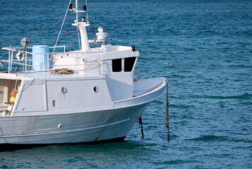 Fototapeta premium Fishing boat moored in the bay