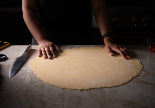 woman hands kneading dough