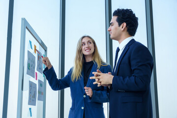 Two businessman and businesswoman partners  in suits smiling standing Talking Discussing presenting...