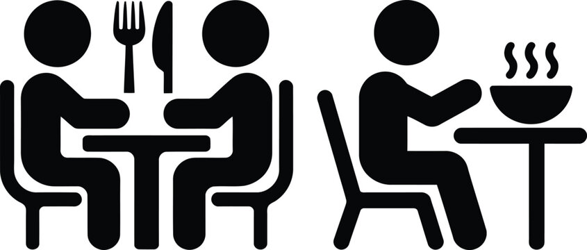 Two people enjoying a meal together at a restaurant with one serving the other