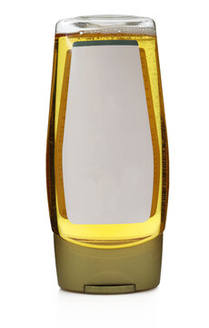 bottle of honey or agava syrup with blank white label isolated on white background
