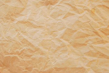 Obraz premium Crumpled fine brown kraft paper texture as background