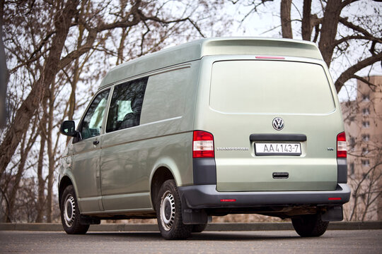 Minsk, Belarus - March, 17 2026: gray Volkswagen Transporter T5 short wheelbase SWB with medium roof van parked in street rear back view.