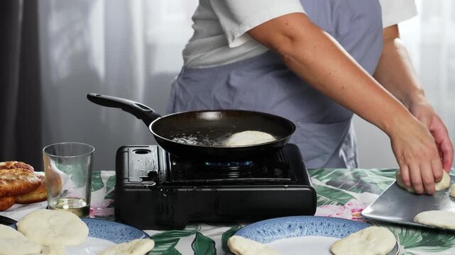 Frying handmade meat pies in a pan with oil. High quality 4k footage