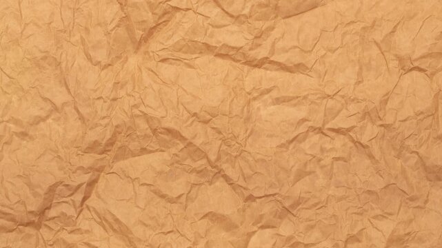 Crumpled brown textured paper background, stop motion, loop textured paper. Wrinkled paper pattern