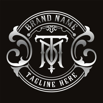 Monogram logo template with TM letters in a luxurious vintage style in silver. Circular design with classic ornaments, perfect for exclusive brand identities, emblems, or premium product labels.
