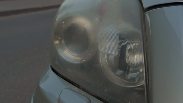 Headlamp restoration process. DIY repair of cloudy headlamp. Steps to fix foggy headlamp with scratches and oxidation