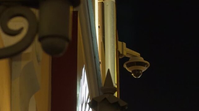 Decorative bracket with golden reflections. Cinematic shot emphasizing screws and mount features in darkness