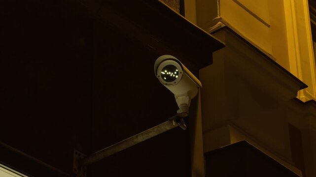 Highresolution security camera with reflective dome overseeing urban entrances for safety and loss prevention