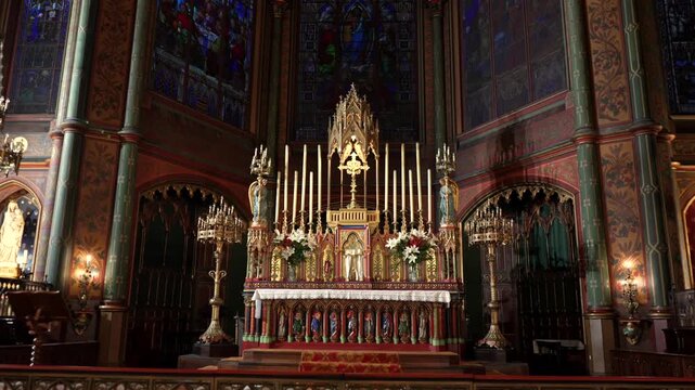 Church altar with gothic details candles and statues Paris France