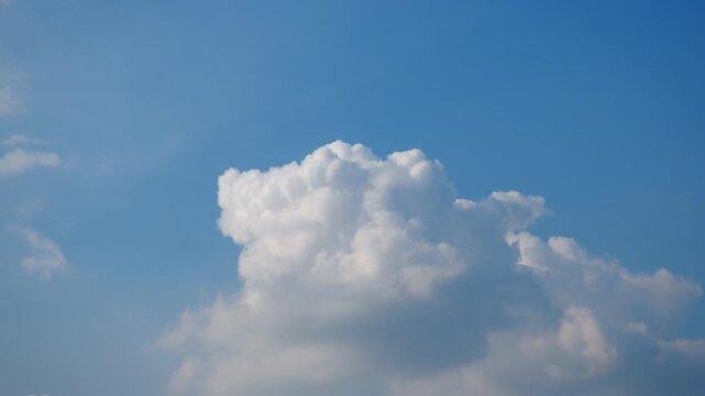 Soft, fluffy clouds float gracefully in a vibrant blue sky. Each frame reveals a unique shape and texture, inviting viewers to appreciate nature's artistry on a tranquil day