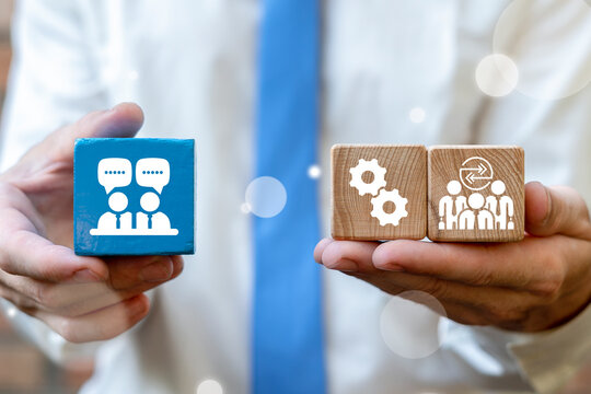 Concept of interpersonal communication skills. Business person holding blocks with icons symbolizing of interpersonal communication skills. Social and business education.