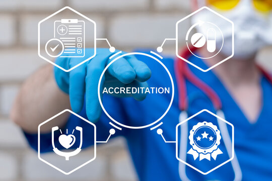 Health care concept of accreditation. Doctor using virtual touch screen presses the text ACCREDITATION. Pharmacy and medicine warranty, standards, ISO quality certification and guarantee.