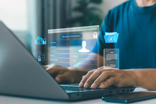 User entering personal information on online registration form via laptop and smartphone. data protection, privacy lock, hidden data, consent form, secure database, private cloud technology.