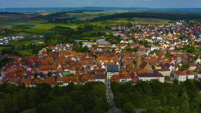 Panorama aerial view of the old town city Volkach in Germany  on a cloudy day in spring.