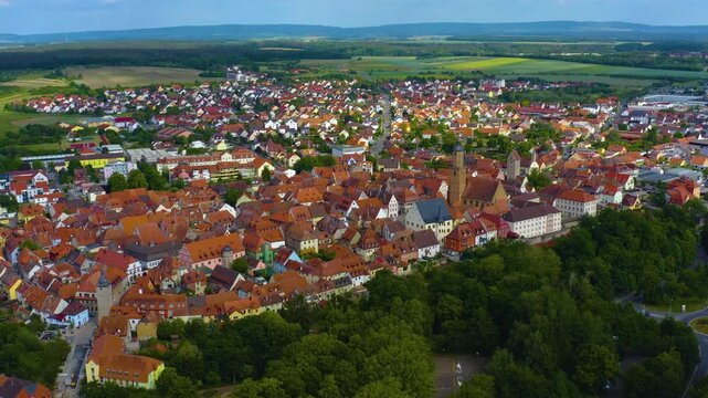 Panorama aerial view of the old town city Volkach in Germany  on a cloudy day in spring.