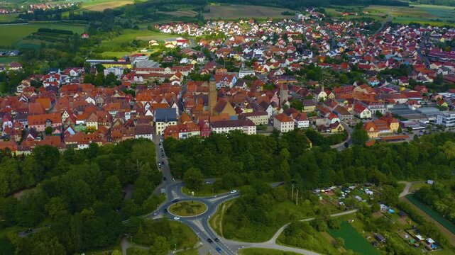 Panorama aerial view of the old town city Volkach in Germany  on a cloudy day in spring.