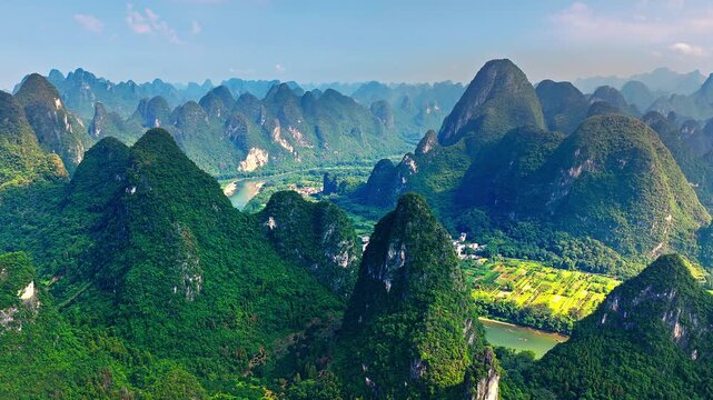 Stunning karst mountain landscape and meandering Li River in Yangshuo, Guilin, China.