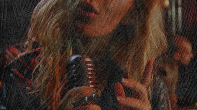 Pulling camera revealing blonde singer at club in studs gripping chrome mic delivering raw vocals