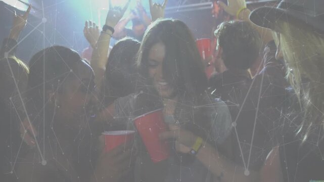 Vertical video: Smiling woman with necklace lifting red cup as pal toasting at club with wristbands