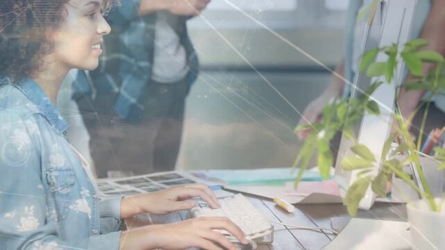 Vertical video: Designer typing, team gesturing, turning forward smiling as HUD reviewing swatch