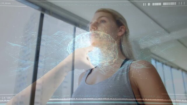 Woman standing in loft as ghost hand touching sternum generating brain hologram for health tech