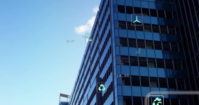 Vertical video: Showing glass tower getting data feed, shifting HUD icons on facade, monitoring CO2