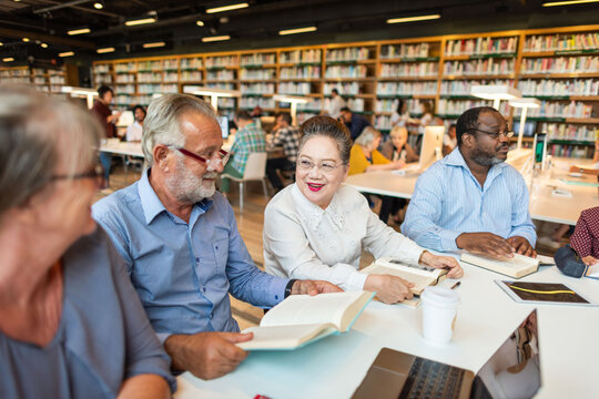 Diverse group reading together.