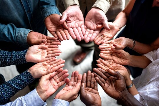 Diverse hands forming unity circle.