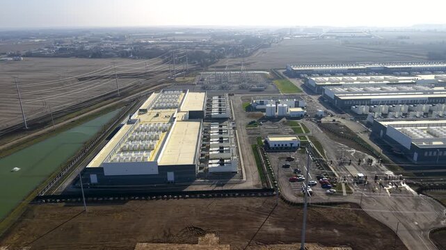 Aerial orbiting shot of large modern technology data center under construction in Ohio