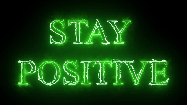 A motivational video showcasing the phrase Stay Positive in neon green letters on a black background