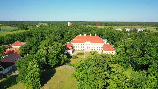 Aerial 4K video from a drone to Suuremoisa baroque manor ensemble in Estonia.  Hiiumaa, Estonia, baltic.