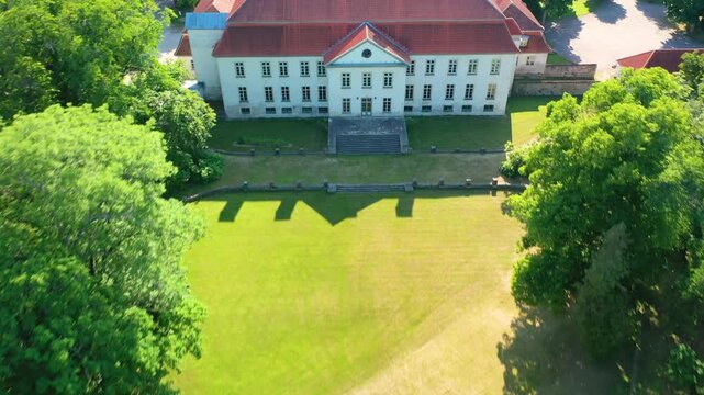 Aerial 4K video from a drone to Suuremoisa baroque manor ensemble in Estonia.  Hiiumaa, Estonia, baltic.