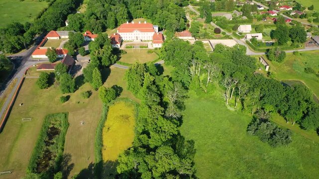 Aerial 4K video from a drone to Suuremoisa baroque manor ensemble in Estonia.  Hiiumaa, Estonia, baltic.