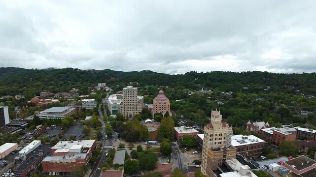 Panoramic Aerial Downtown Asheville With Rolling Hills, Wide City View Including Pink Dome And Tower, Tree Canopy Lining Streets, Overcast Atmosphere, Urban Planner Perspective For Mapping