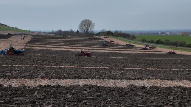 Overview of a ploughing match in progress in Wiltshire