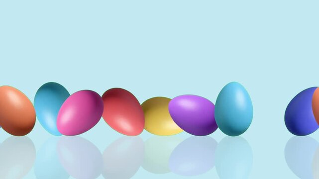 4K loop animation of colorful Easter eggs rolling smoothly on a blue background with reflection effect and copy space, creating a cheerful festive scene perfect for spring promotions, holiday greeting