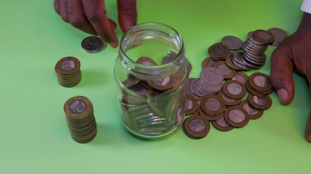 A detailed close-up of Ghana&rsquo;s Cedi and Pesewa coins. The video highlights bimetallic designs and cultural motifs like the Scale of Justice and cocoa pods, emphasizing national economic identity.