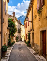 Fototapeta premium Charming French Village Street with Mountain View.