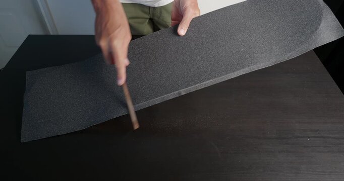 Preparing Grip tape  for a Skateboard Deck.  