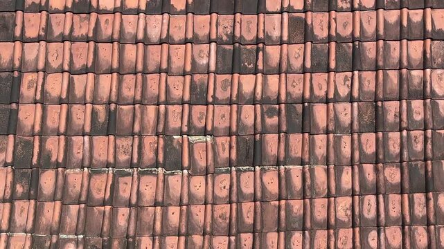 Orange roof tile from the front view. close up. background, background, copy space, empty, free, negative, text, design. weathered. Tiled roof texture. Background for banner, backdrop