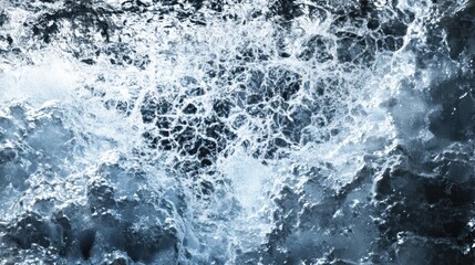 Fototapeta premium Close-up abstract view of intricate ice patterns formed by frozen water, showcasing detailed textures and natural crystalline formations.