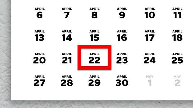 The date April 22nd marked with a red cursor on the wall calendar 2026