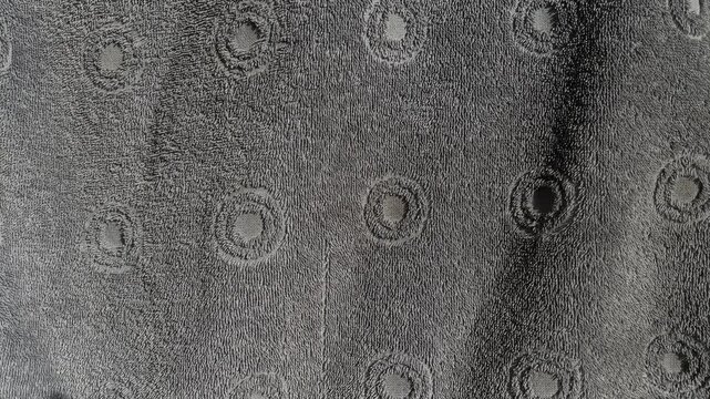 Close up view of dark blue shower towel texture. Fluffy carpet background. Blank bathroom textile. Warm sweater natural material. Fabric backdrop detail. Blue flat surface. Home canvas design.