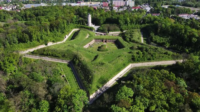 Aerial view of historic Prusy Fort surrounded by forest and urban area in Nysa, Poland. Concept of military architecture, cultural heritage and travel destination