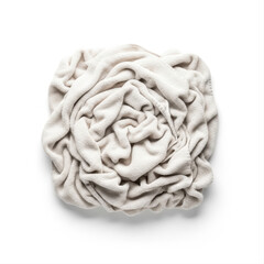 Obraz premium Wrinkled cotton towel isolated on a white background, artistically arranged in a circular shape with soft folds and texture
