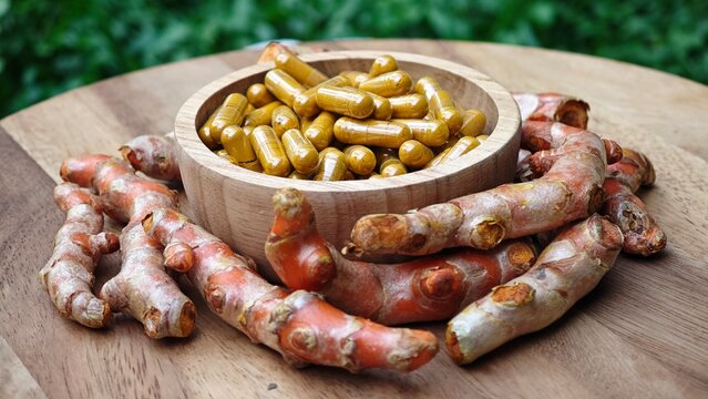 Turmeric curcumin capsules with rhizome (root).