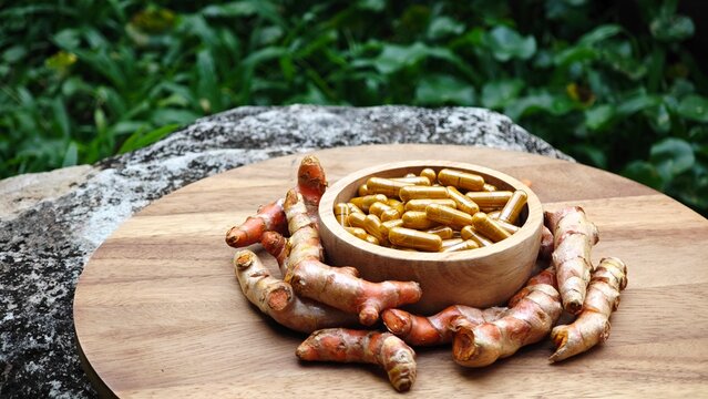 Turmeric curcumin capsules with rhizome (root).